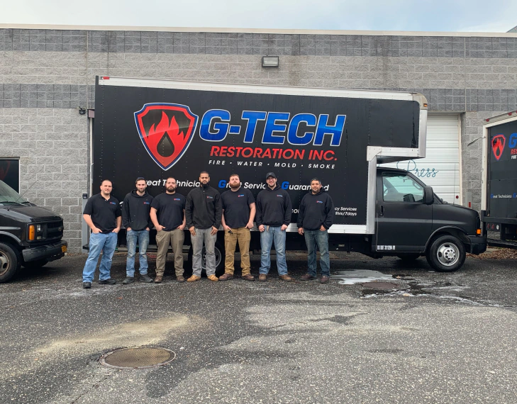 g tech restoration inc service truck and workers
